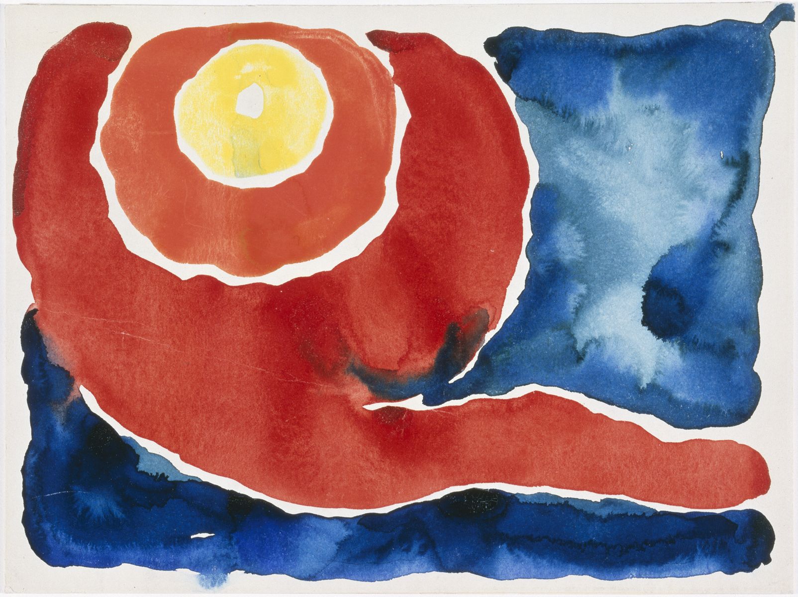 Watercolor. Warm orange and red rings surround a yellow ring near the upper left corner. The rest of the field is filled with pools of shades of lapis blue. The yellow circle is near the upper left corner. The white of the unpainted paper separates it from the clay-orange ring surrounding it, which is then encircled in a red ring. A tail-like line extends from the outer, red ring to stretch to the right edge of the paper. The blue paint of the sky touches the red ring along the left edge and near the red line so blue and red bleed together in those two areas. The blue areas are especially mottled with wet-on-wet blue pigment.