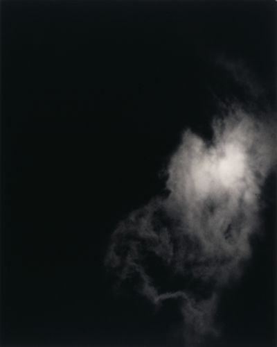A black background with a white cloud floating the bottom right quadrant.